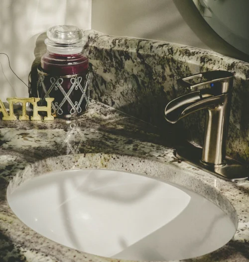 close up shot bathroom sink made in marble